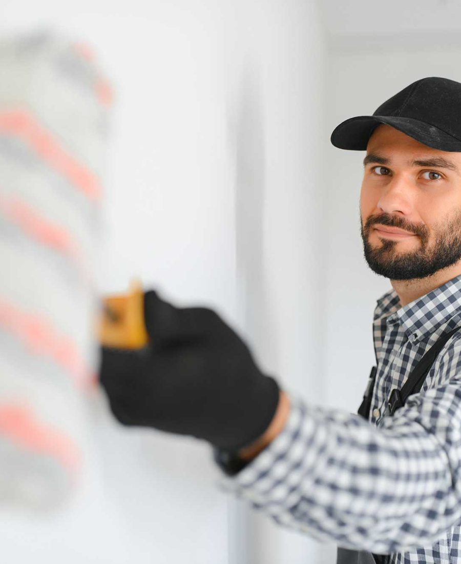 young-worker-painting-wall-in-room-2025-03-13-14-24-41-utc